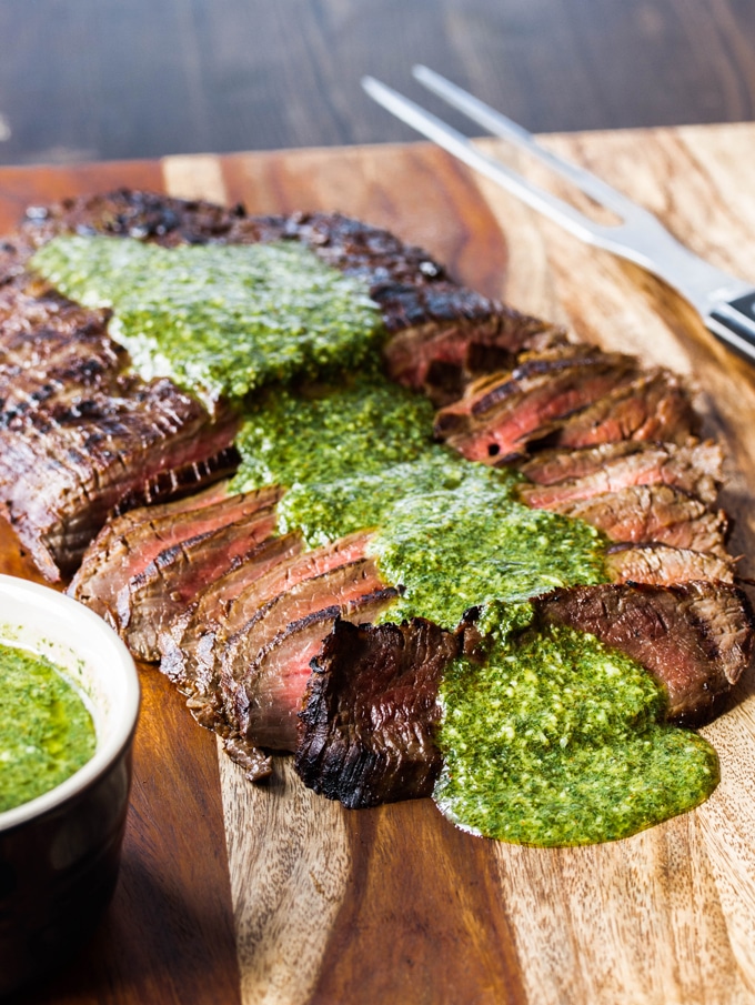 Grilled Flank Steak sliced and drizzled with Chimichuri sauce 