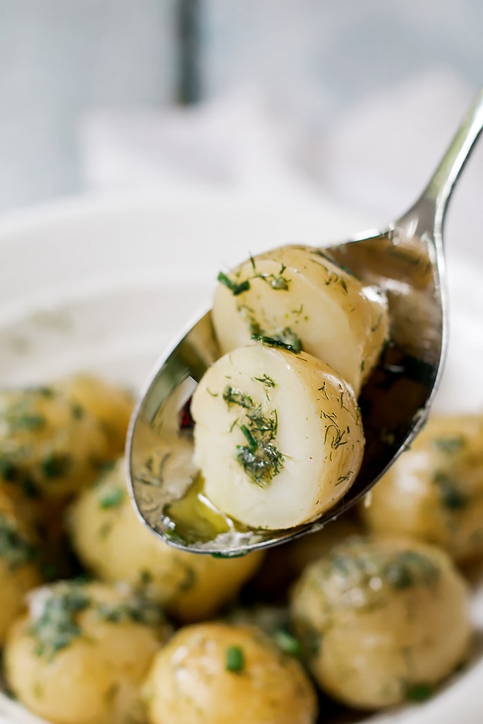 Garlic Potatoes being scooped up with a spoon