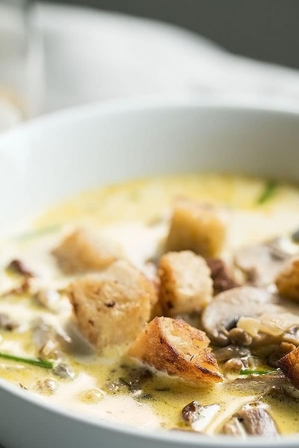 close up of mushroom soup with croutons
