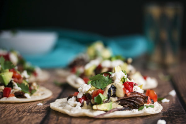shredded beef, avocado, tomato, cheese and creamy salsa verde all on top off a corn tortilla