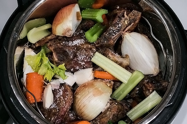 instant pot with veggies and bones for bone broth