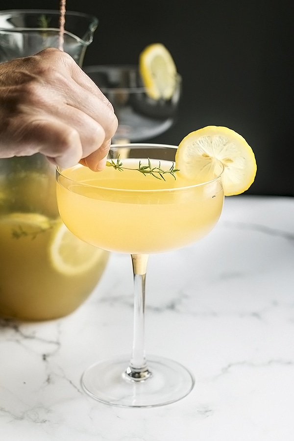garnish the bees knees cocktail with a sprig of thyme