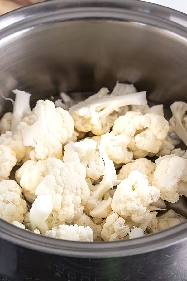 cauliflower being steamed in a pot