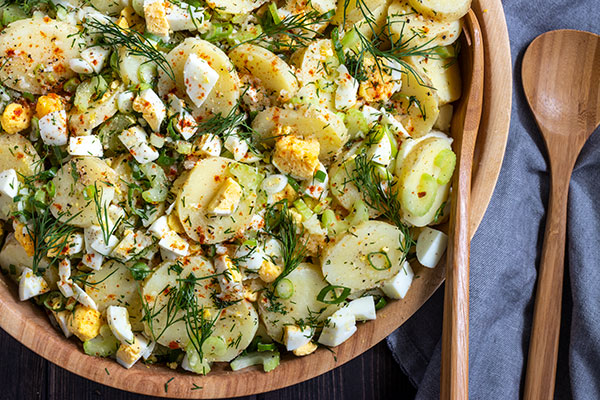 top down view of this potato salad recipe with lots of dill on top