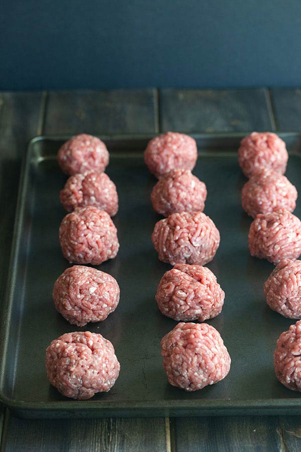 raw burger balls on a tray ready to take to the bbq