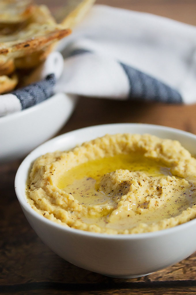 a close up picture of a bowl of this truffled hummus recipe
