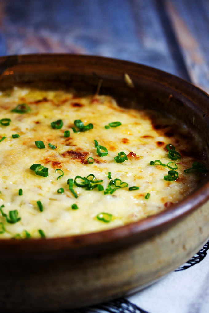 a bowl of hot cheese dip straight out of the oven